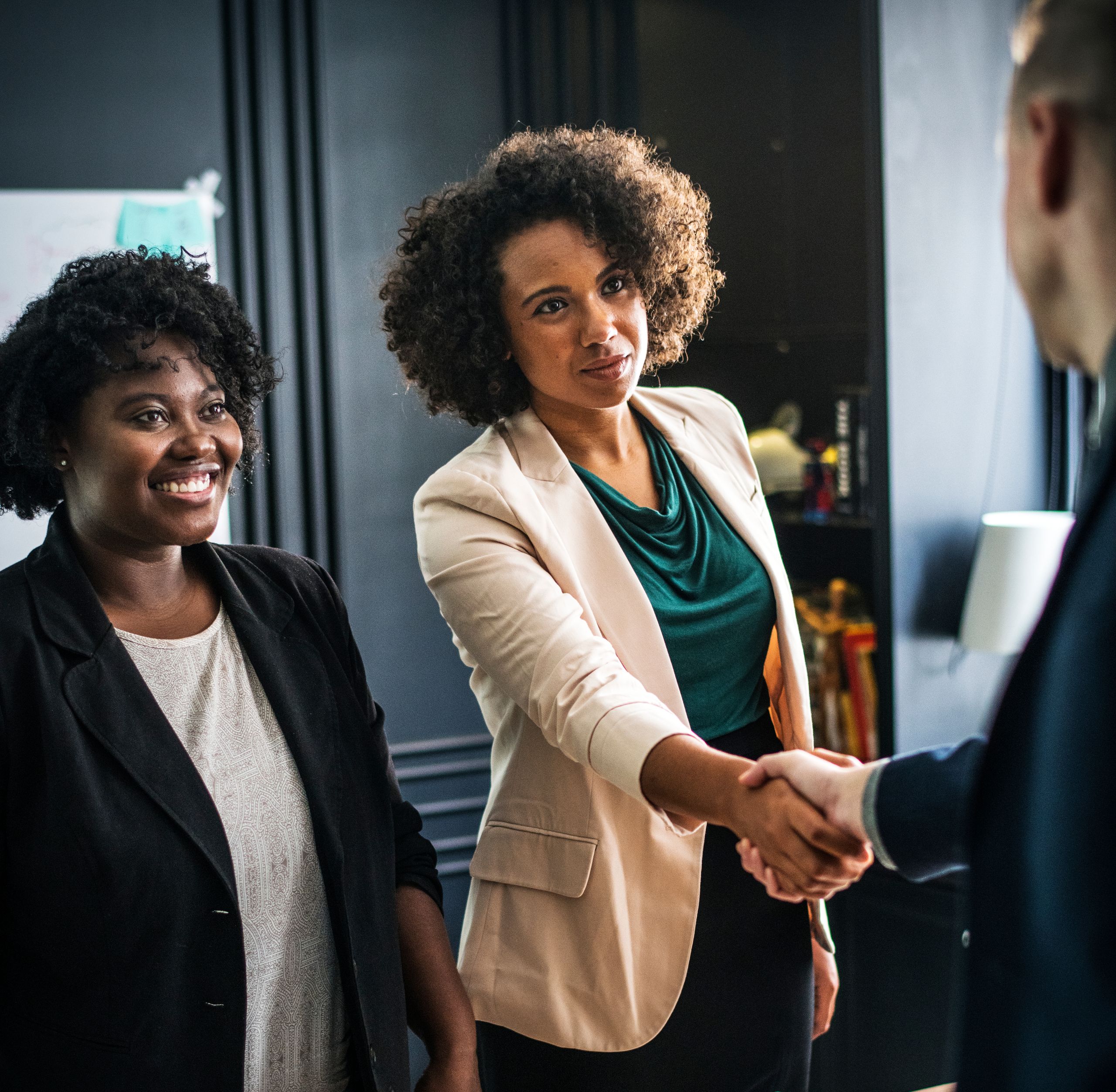 Small business owners shaking hands